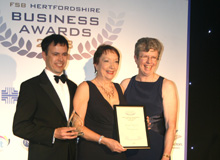 Jan and David collecting their 'East Herts Business of the Year' award from FSB Hertfordshire chair, Pam Charman.